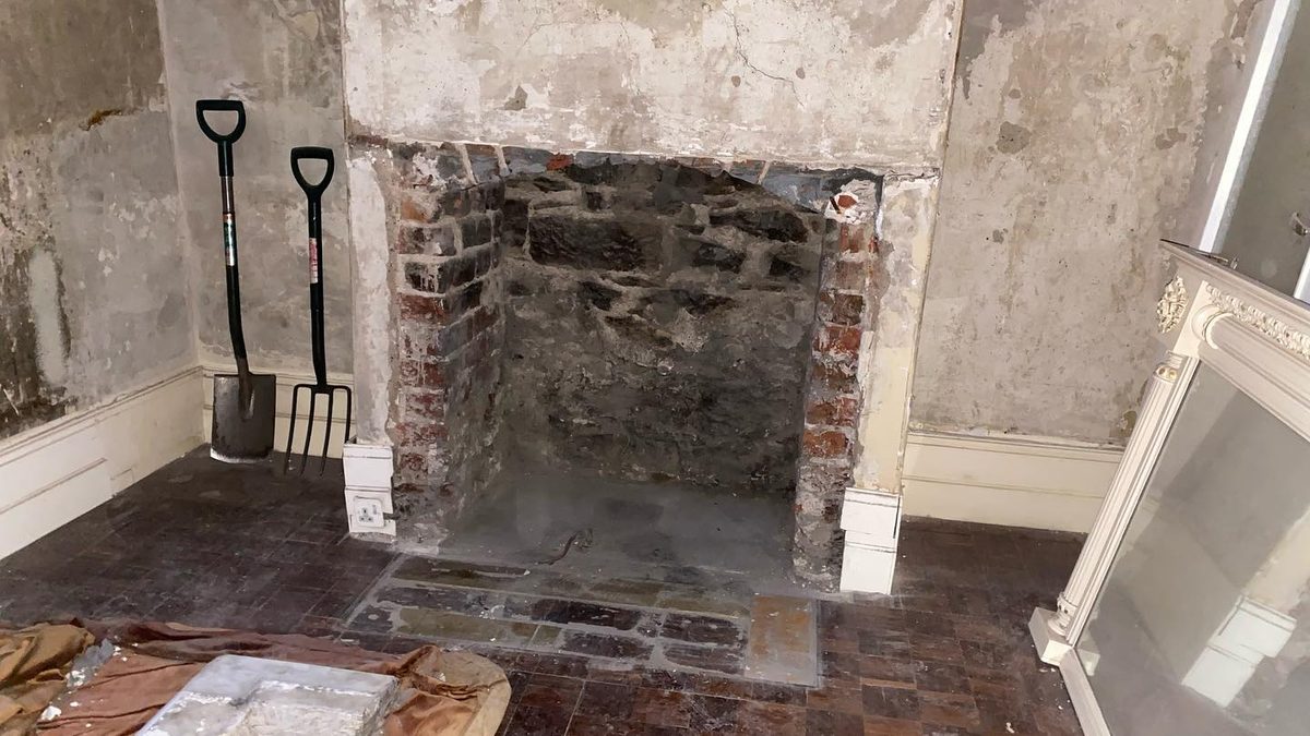 A fireplace opened up — green tiles and arches (2/2)