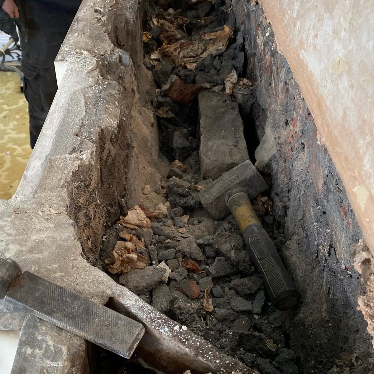 The marble fireplace being removed for restoration (2/5)