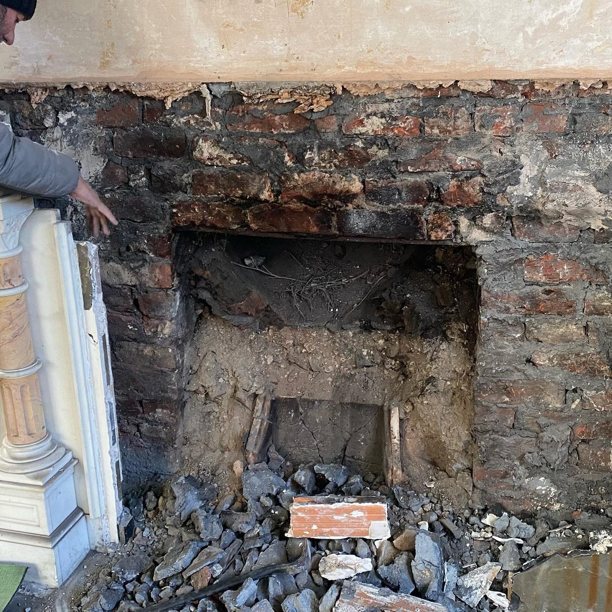 The marble fireplace being removed for restoration (3/5)