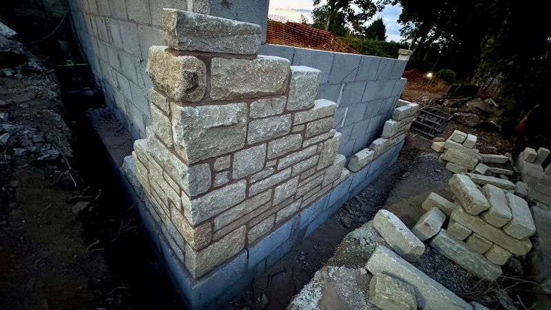 New stonework being laid for the extension