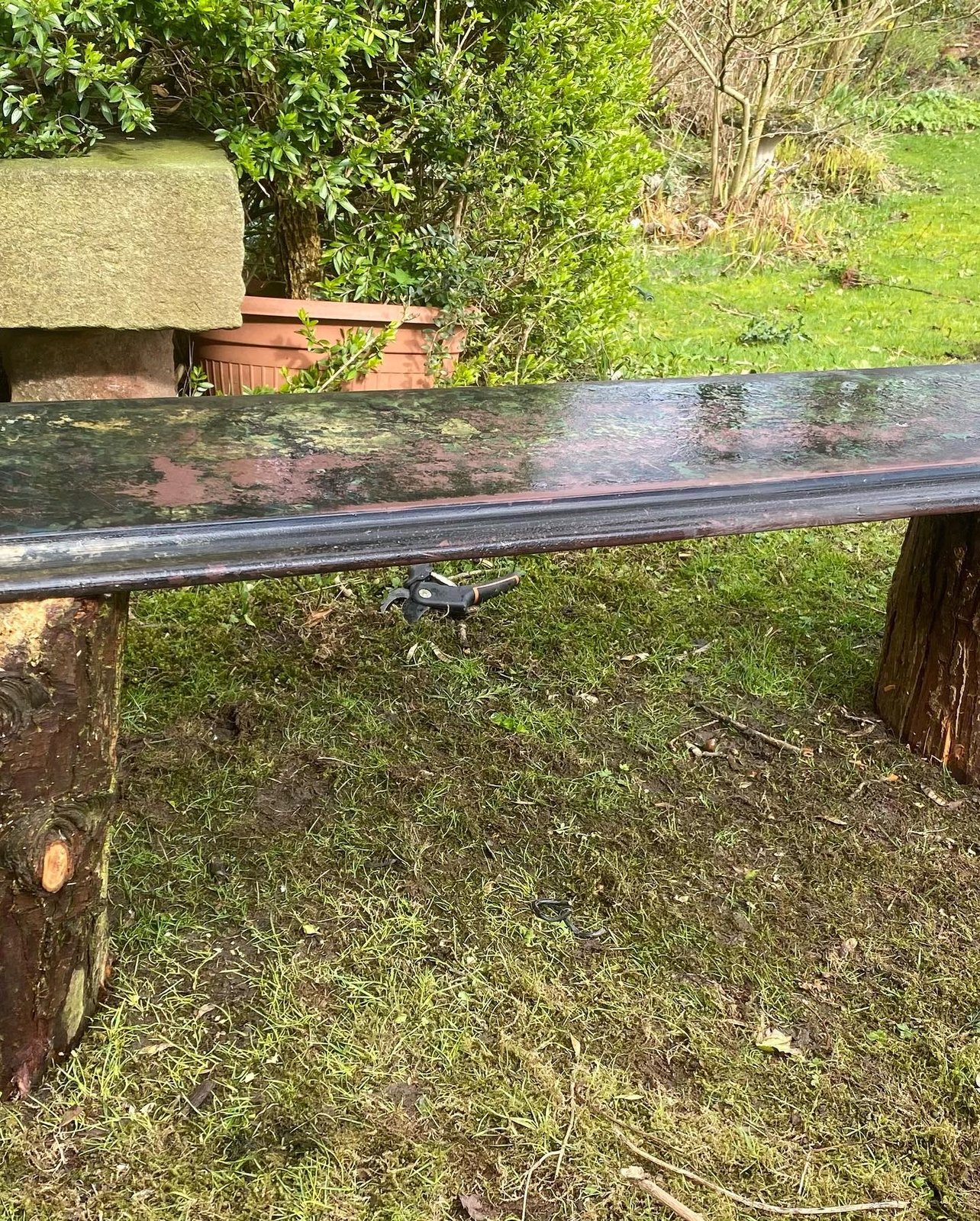 The slate fire mantel dug up from the garden